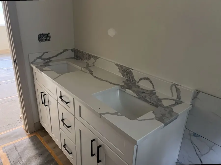 Marble-look vanity top with bold grey veining