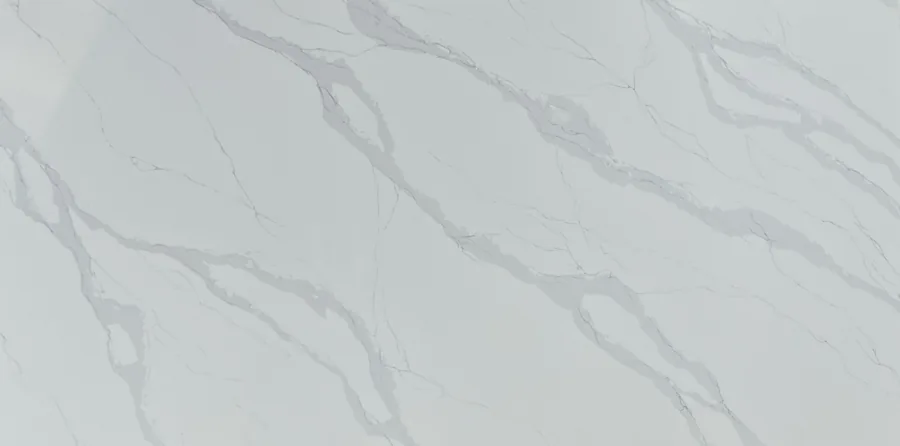 Two halves of a quartz slab meeting at a book-matched seam